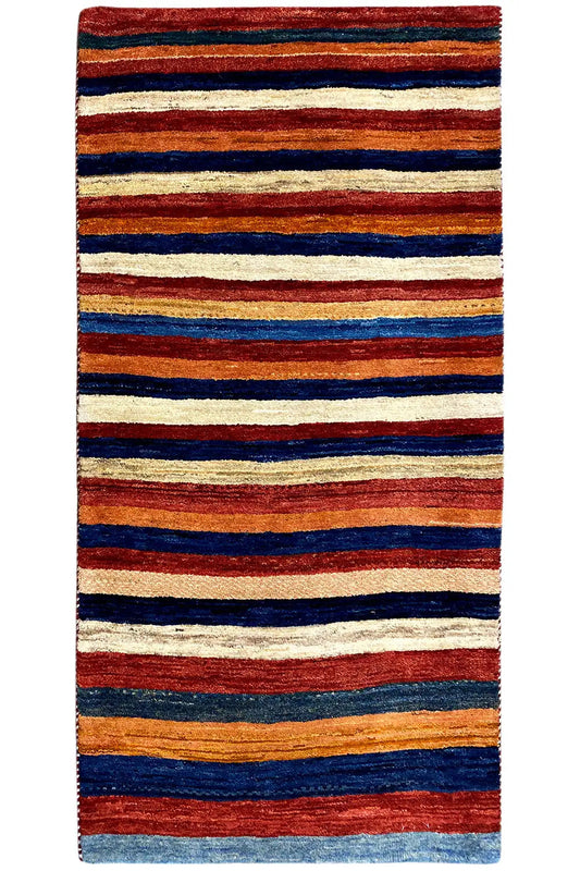 Gabbeh rug with a broad striped pattern in red, blue, orange, and cream