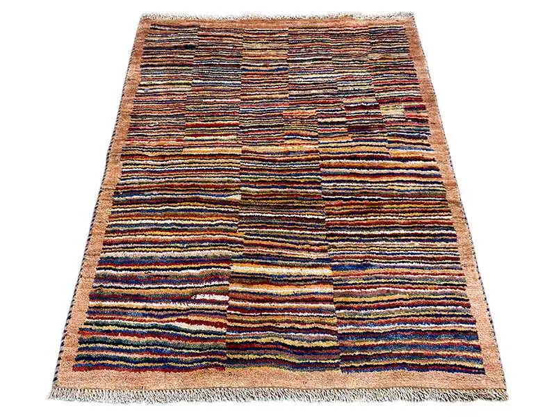 Rectangular rug with a multicolored striped pattern and fringes