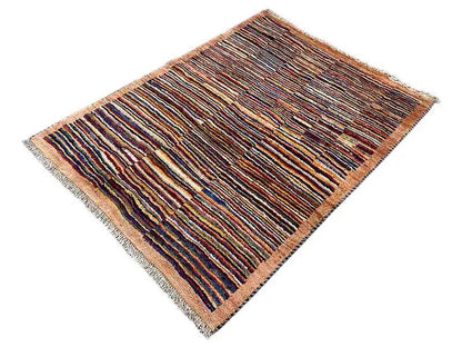 Rug with a brown base and multicolored stripes, rectangular, fringes visible