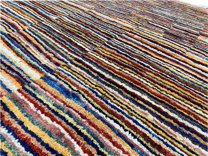 Close-up: multicolored stripes on a densely woven beige carpet
