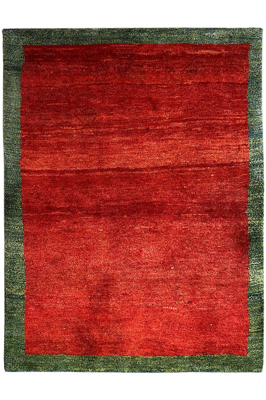Rectangular red Gabbeh rug with a wide green border