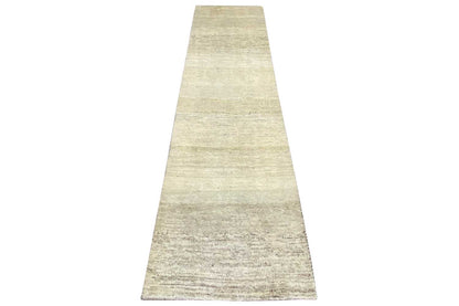 Gabbeh rug with a visually tapered shape, light beige mottled surface, 299x84 cm