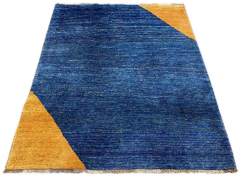 Blue Gabbeh rug with yellow triangles, mottled surface, rectangular
