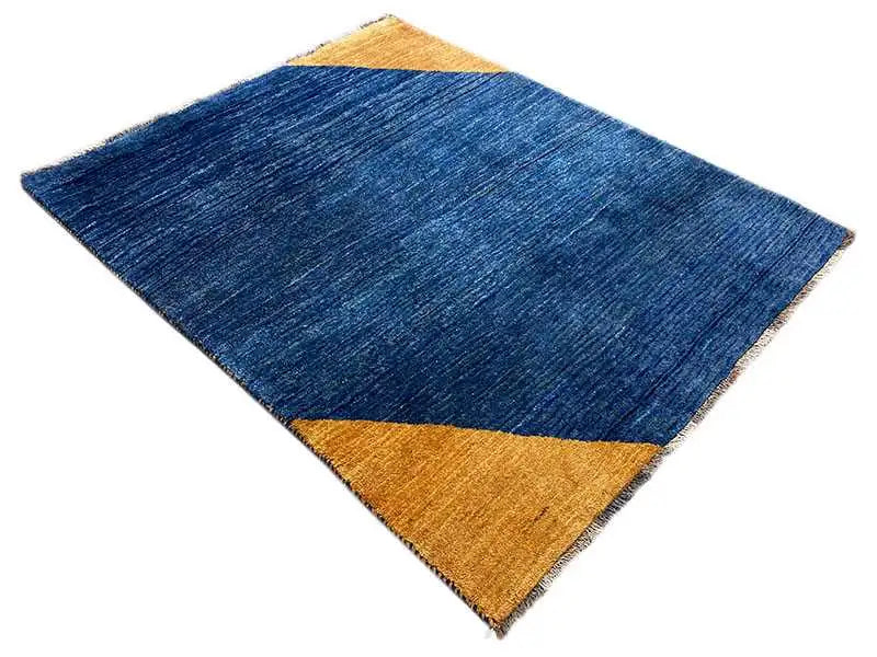 Blue rectangular rug with a yellow triangle and diagonal pattern