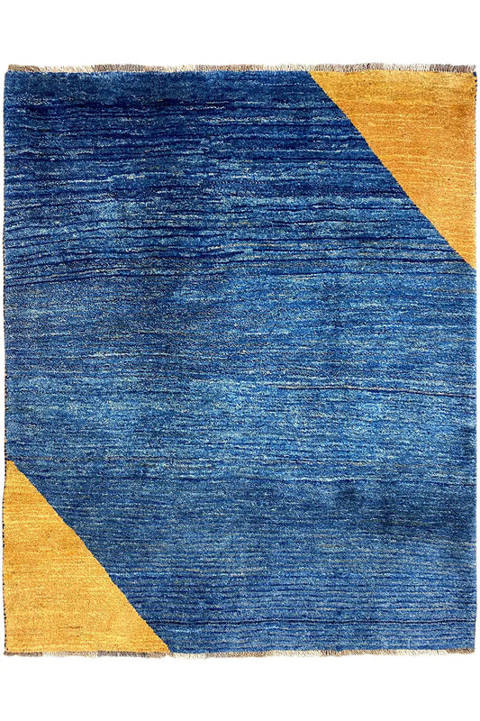 Rectangular blue rug with yellow triangles, mottled texture, fringes