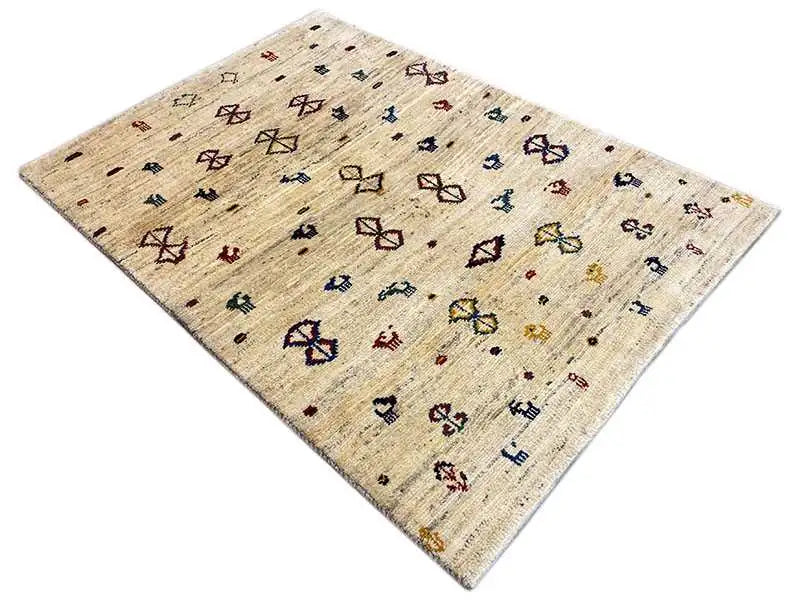 Gabbeh rug 164x116 cm, beige with colorful geometric figures, laid diagonally