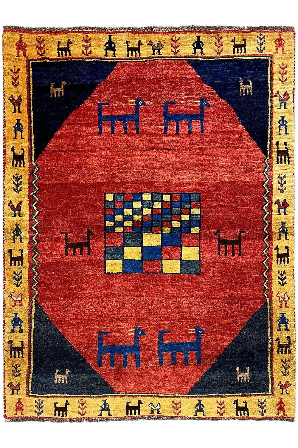 Gabbeh rug with a red diamond pattern, blue background, yellow border, and fringe