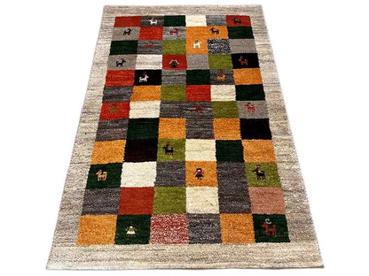 Gabbeh rug (149x96 cm) with patchwork squares and animal motifs, multicolored