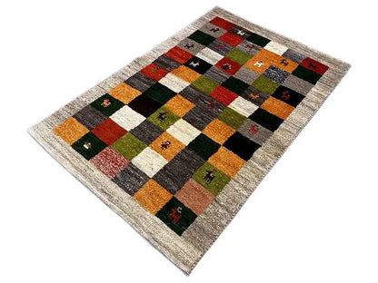 Gabbeh rug (149x96 cm) with a checkered pattern of colored fields and small animal images