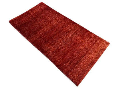 Gabbeh rug, rectangular, reddish brown, diagonal, fine striped texture