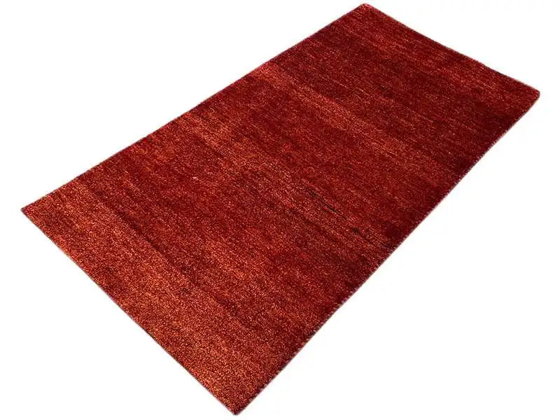 Gabbeh rug, reddish brown, rectangular, smooth pile surface with fine grain