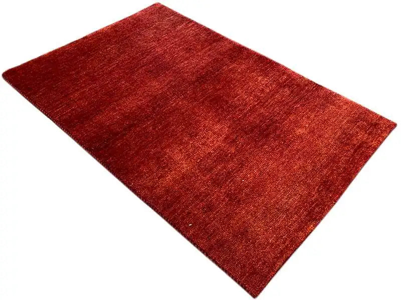 Gabbeh rug, rectangular, reddish-brown, diagonal view, fine mottled texture