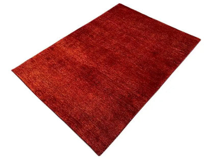 Gabbeh rug in reddish brown, rectangular, low pile with an even weave texture