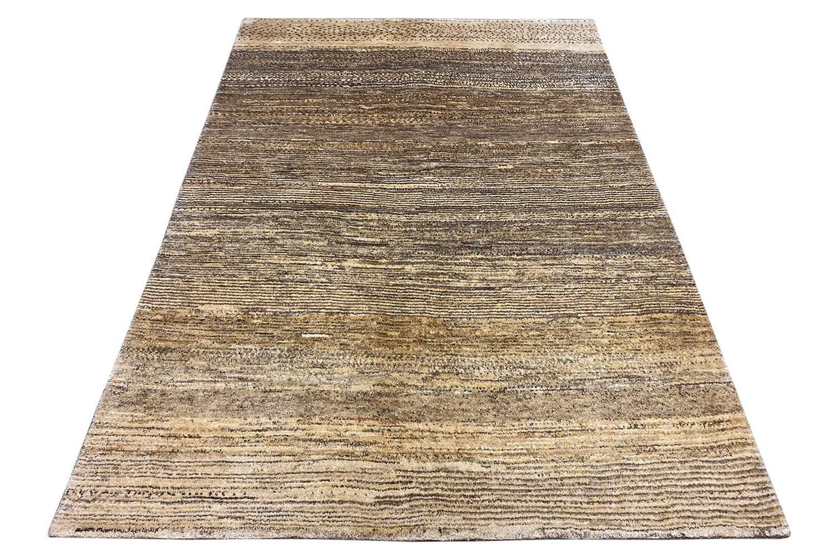 Gabbeh rug with a mottled striped pattern in beige, brown, and gray