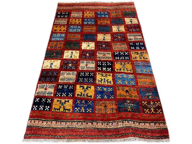 Gabbeh rug with colorful patchwork fields and border, rectangular, fringed edges