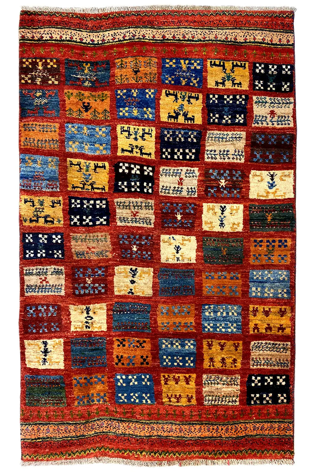 Gabbeh rug in a patchwork design, many color blocks, decorative border, rectangular