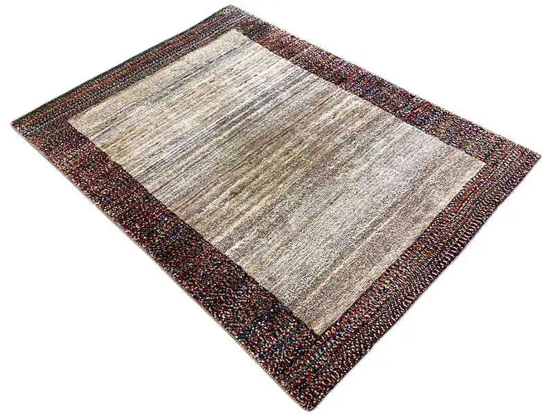 Gabbeh rug 142x107 cm, rectangular, beige pile with a dark, mottled border