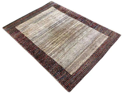 Gabbeh rug 142x107 cm, rectangular, beige pile with a dark, mottled border