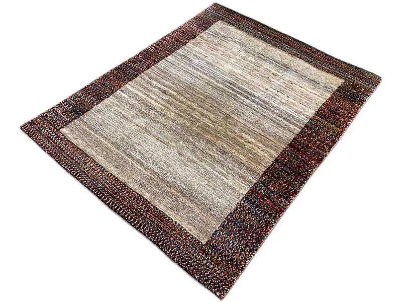Gabbeh rug 142x107 cm, diagonal view: beige interior with colorful border