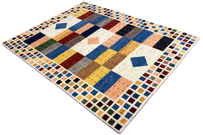 Gabbeh rug in oblique view with multicolored stripes, diamonds, and border tiles