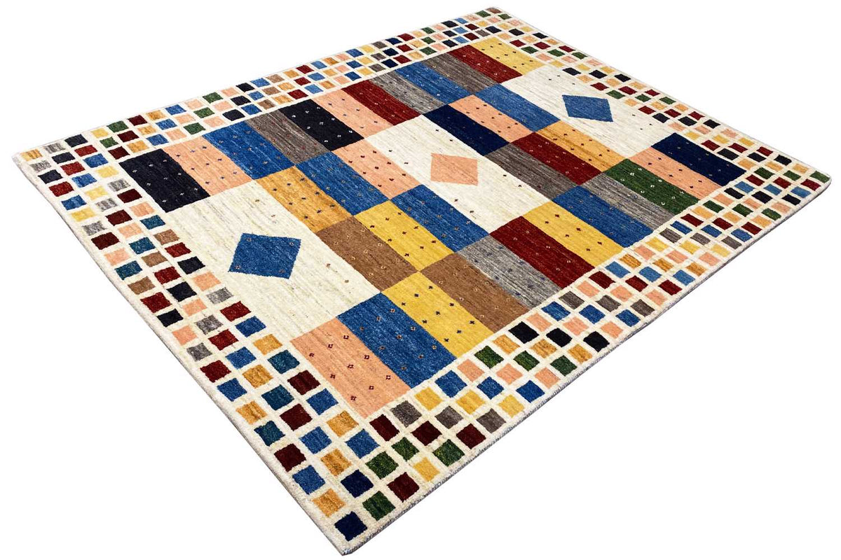 Gabbeh rug with diagonal color blocks in blue, yellow, brown, and cream