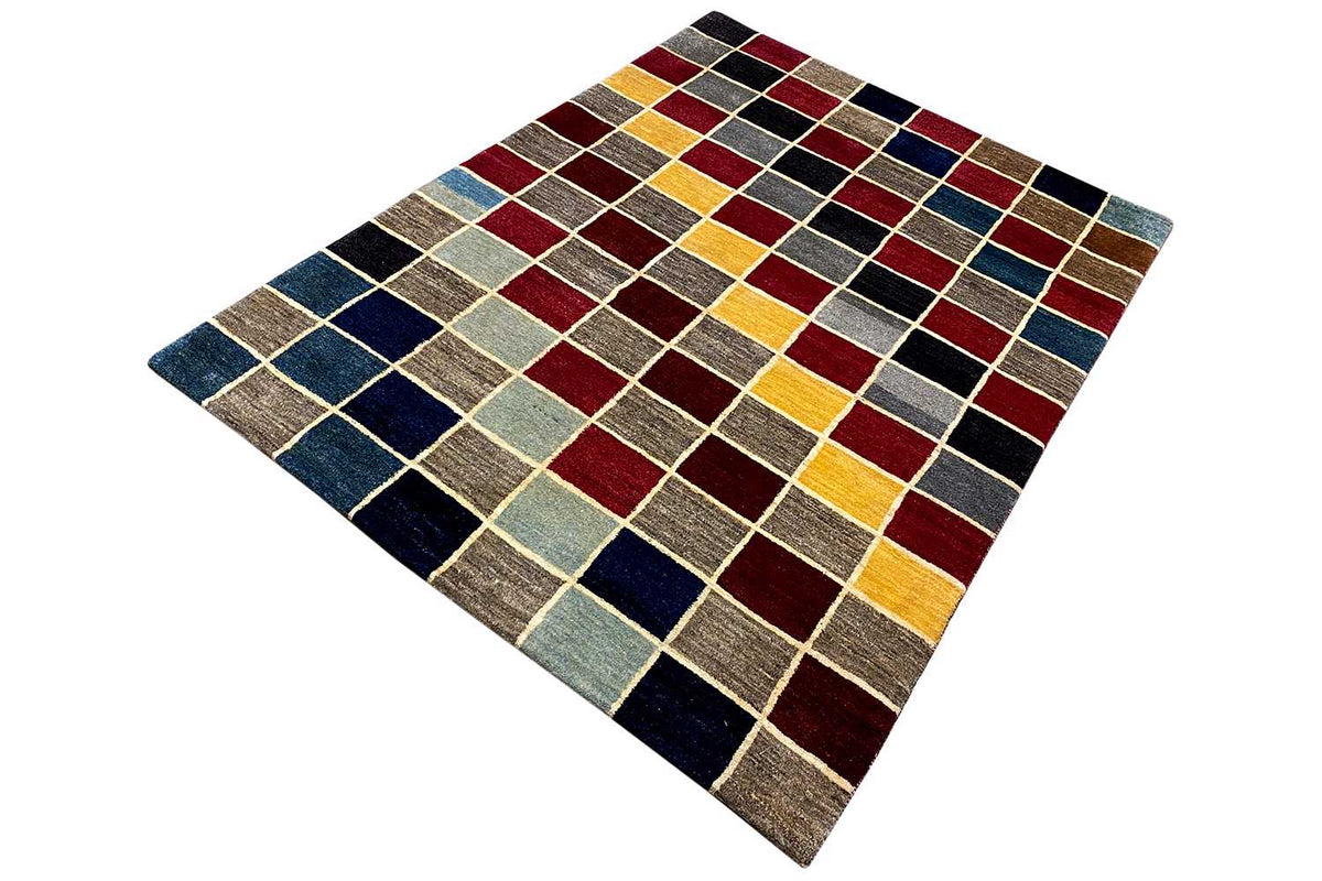 Gabbeh rug with a multicolored checkered pattern in red, blue, and yellow, laid flat