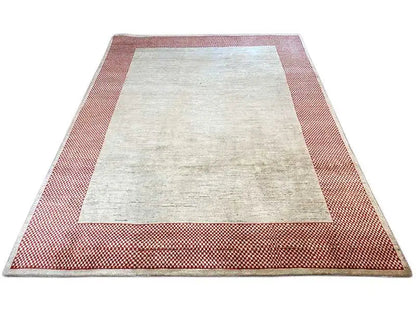 Gabbeh rug with a beige central field and red-and-white checked border, rectangular