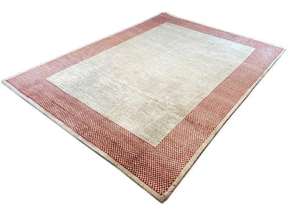 Gabbeh rug, beige central field with a red-and-white checkered border, appearing square-shaped