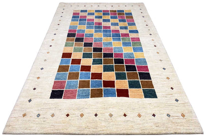 Rug with a Gabbeh pattern: broad grid of squares in blue, red, and yellow on a light beige background