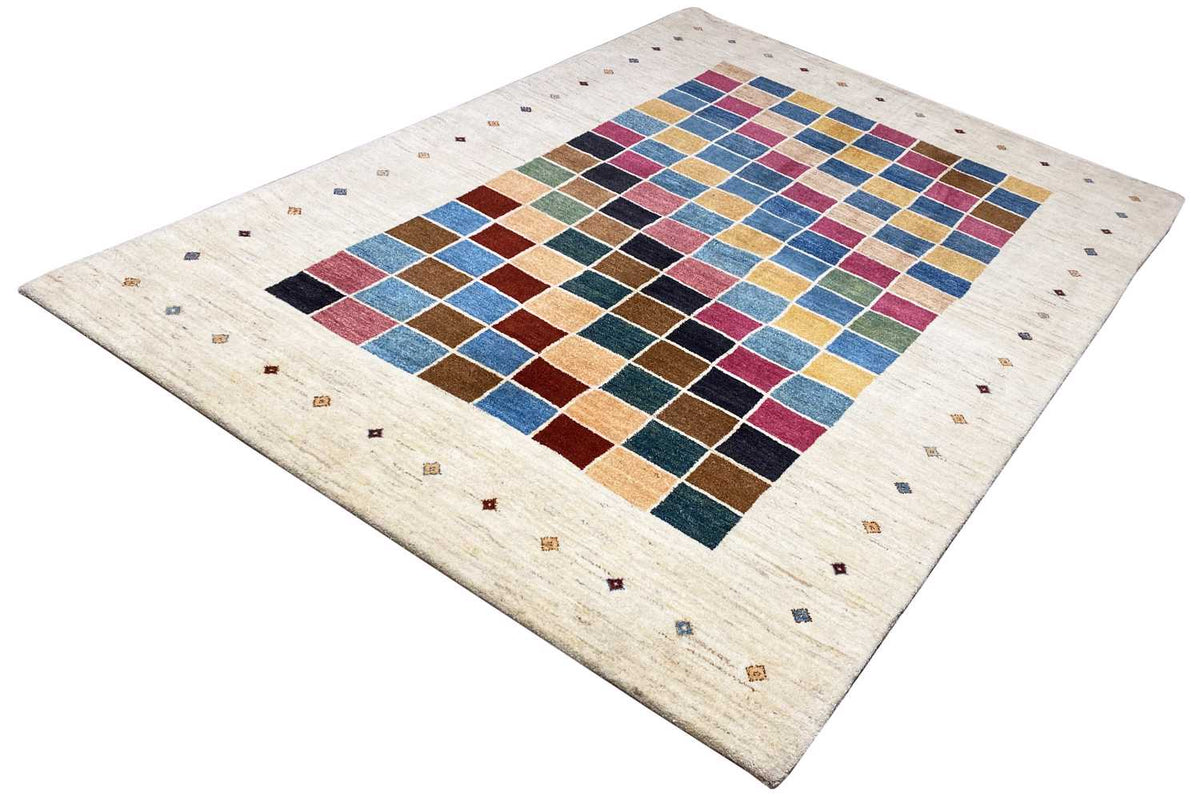 Rug with a geometric pattern in Gabbeh style, colorful fields on a light background