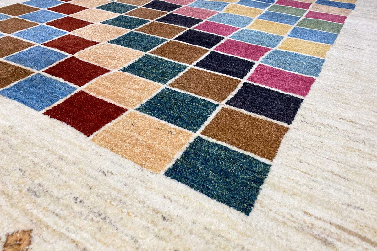 Close-up: Rug with colorful square patterns and a light background, with a visible pile texture