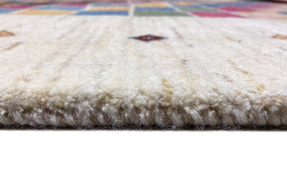 Carpet edge with dense pile and a multicolored border at the edge, on a light background