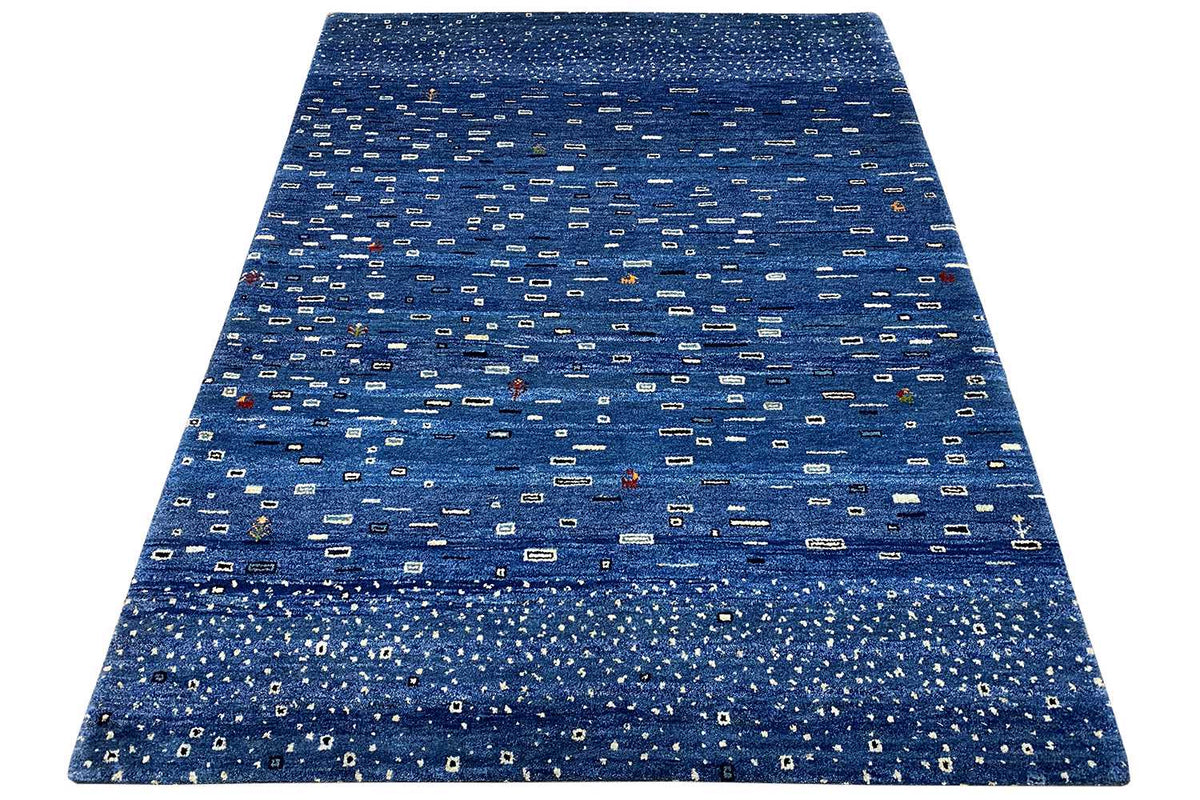 Gabbeh rug, blue patterned, dense texture, with a border all around