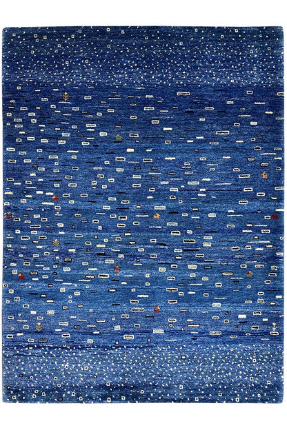 Gabbeh rug with a blue pattern and fringes all around