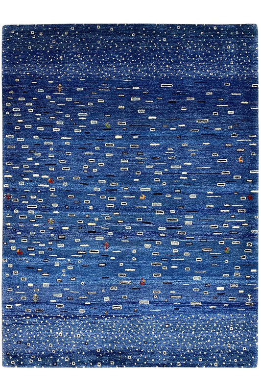 Gabbeh rug with a blue pattern and fringes all around