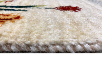 Rug border with a dense pile on a cream-colored background and colorful embroidered elements