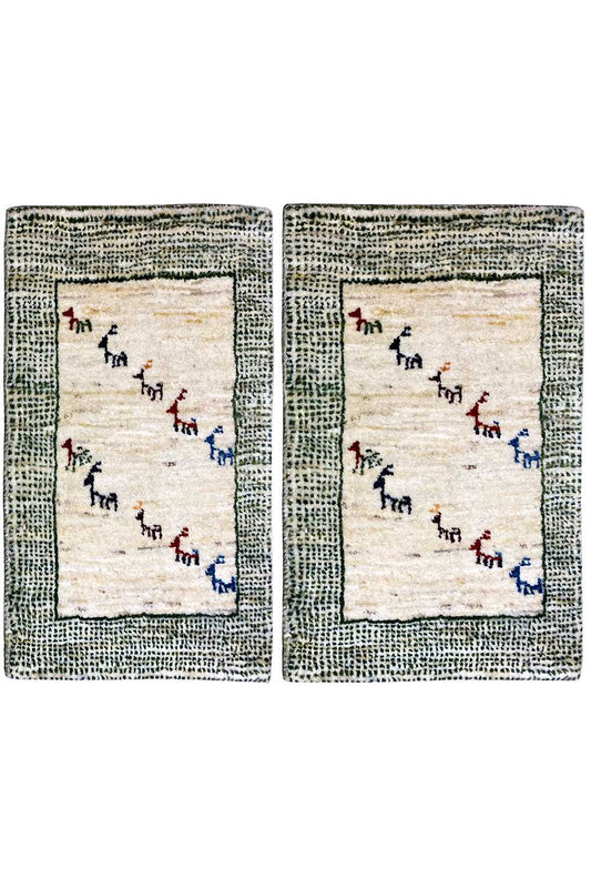 Gabbeh rug: beige pile with a gray-green border and multicolored animal motifs