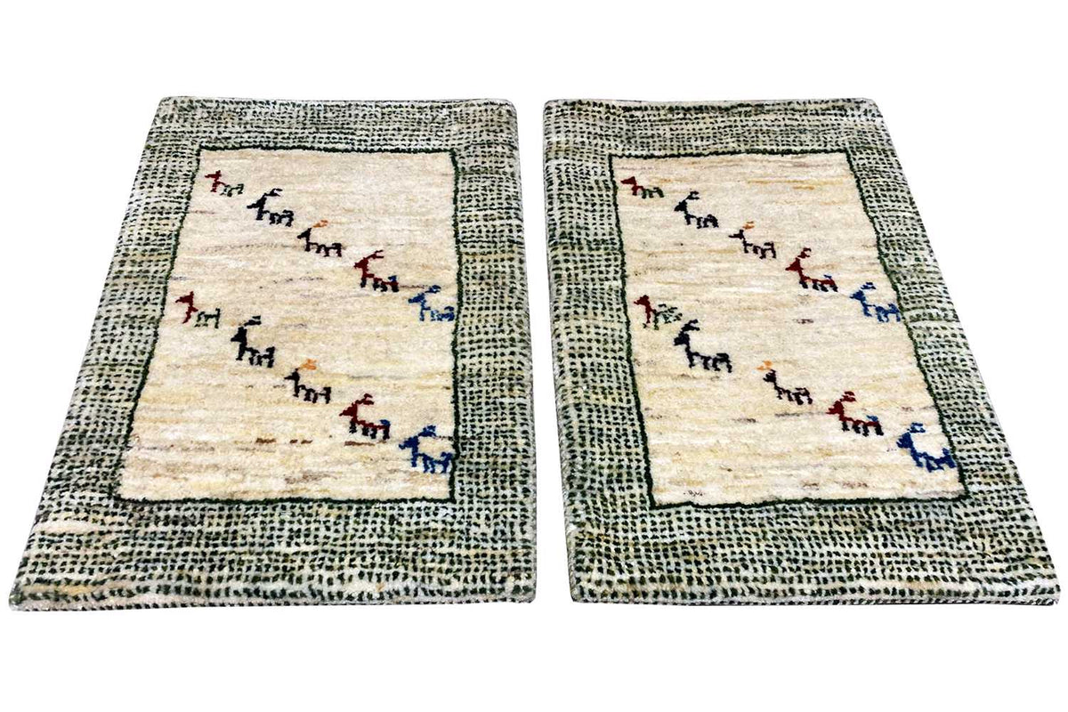 Rug pair: beige base, gray-green textured border, animal frieze in blue/red