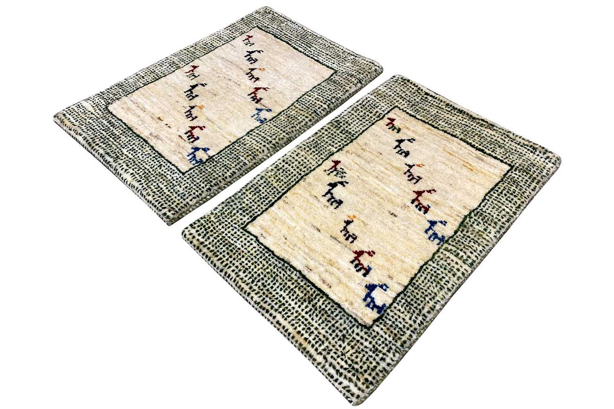 Rug set with a beige center, a gray-green border pattern, and colorful animal motifs