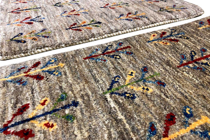 Gabbeh rug 40x60 cm Detail: beige pile with a colorful vine pattern and relief texture