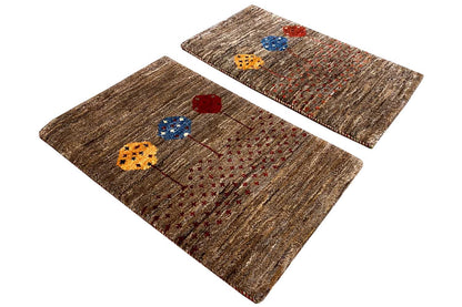 Two brown Gabbeh rugs, 40x60 cm, with colorful floral embroidery, side by side