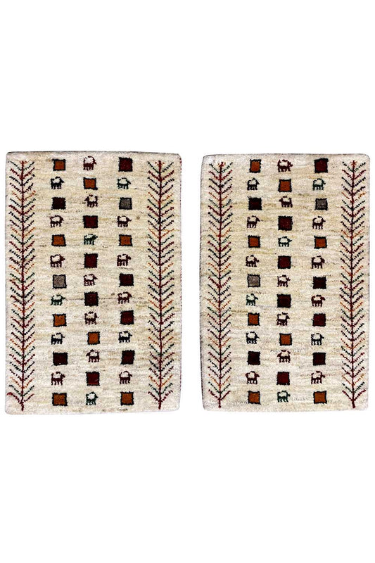 Gabbeh rug, cream-colored with a square pattern and red decorative borders