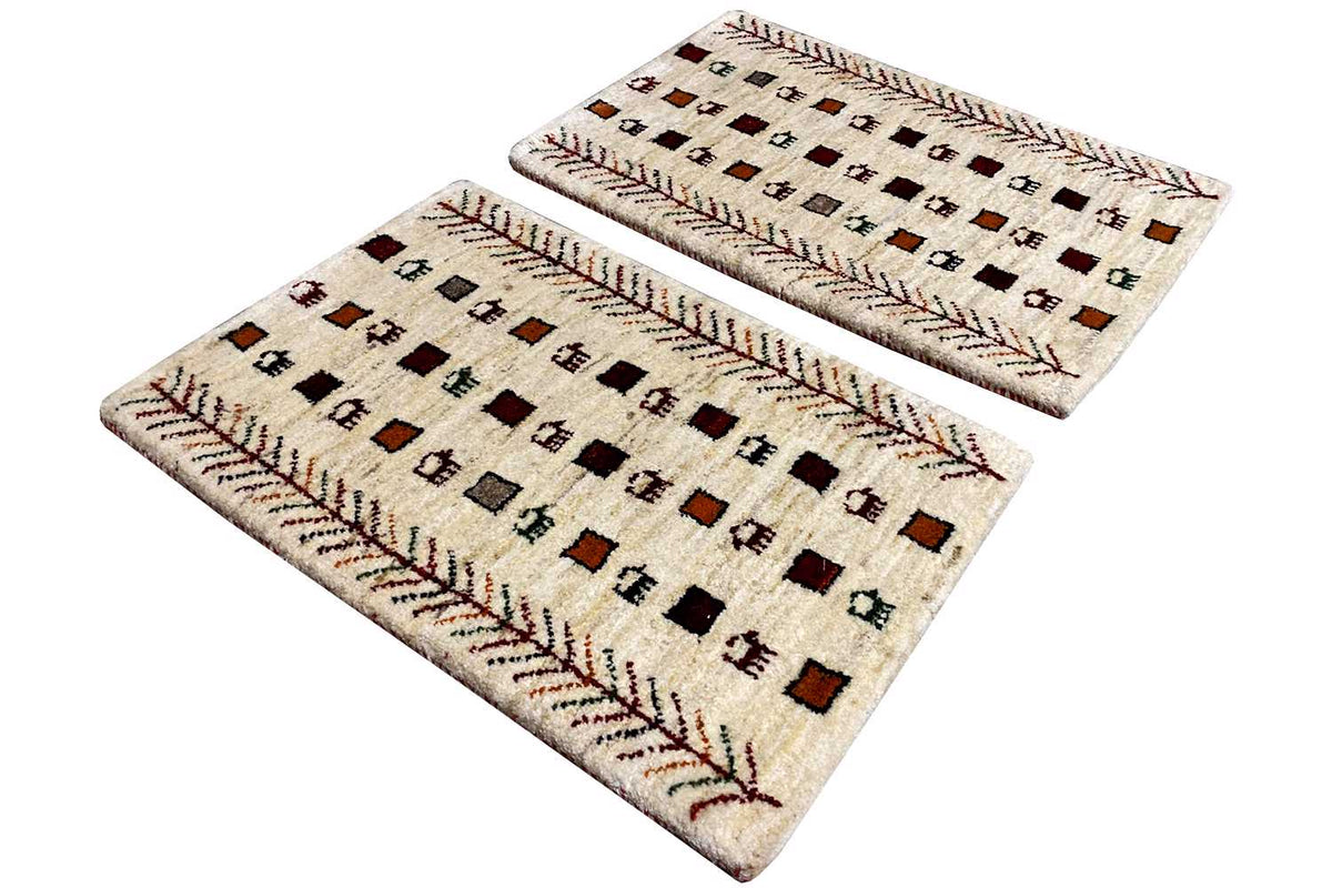 Two Gabbeh rugs with a square pattern, cream-colored and red decorative borders