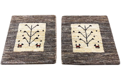 Square Gabbeh rug with beige square and black tree motif, gray pile