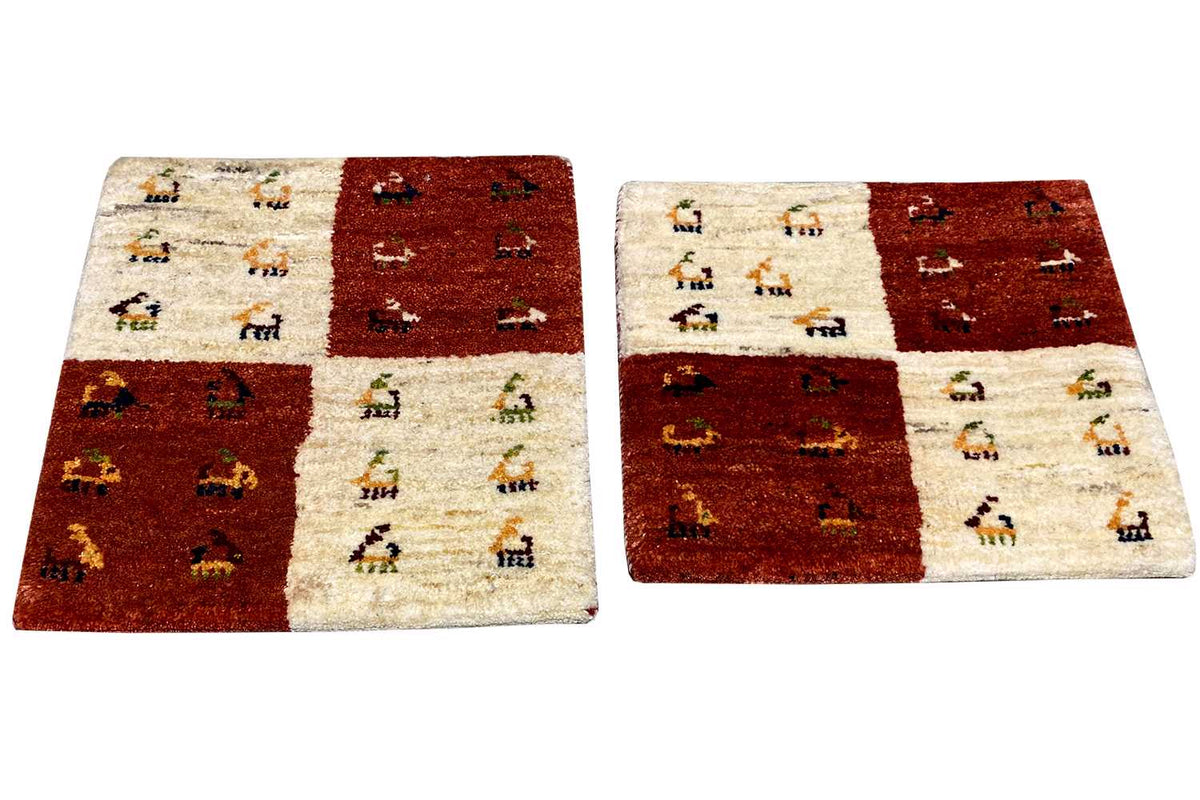 Rectangular Gabbeh rug, reddish brown/cream, with small motif panels in a patchwork style