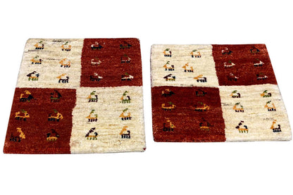 Rectangular Gabbeh rug, reddish brown/cream, with small motif panels in a patchwork style