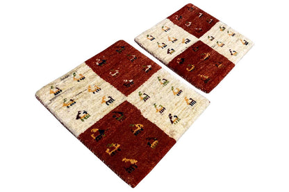 Rectangular Gabbeh rug, reddish brown and cream, field pattern with figurative motifs