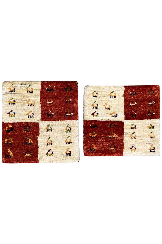 Rectangular Gabbeh rug, reddish brown and cream, with small figurative patterns