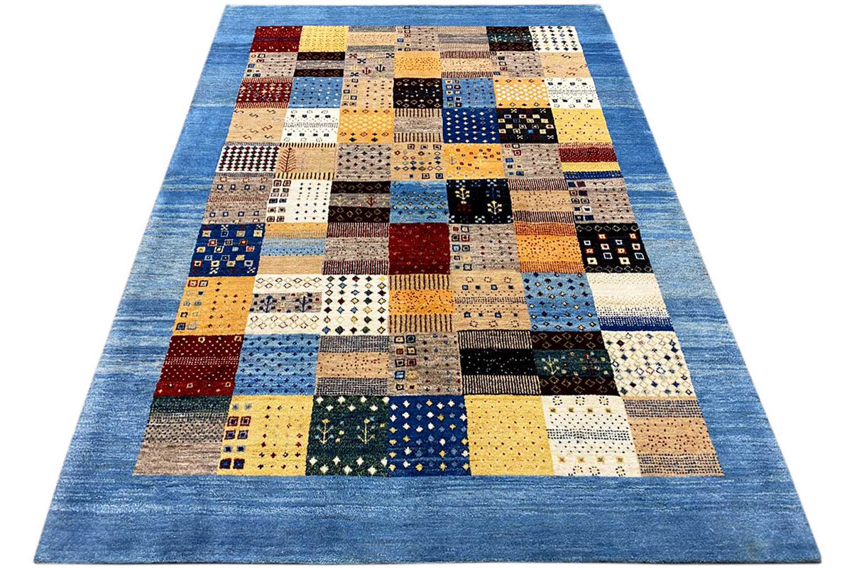 Geometric Gabbeh rectangular rug with patchwork layout in blue, yellow, black, and beige