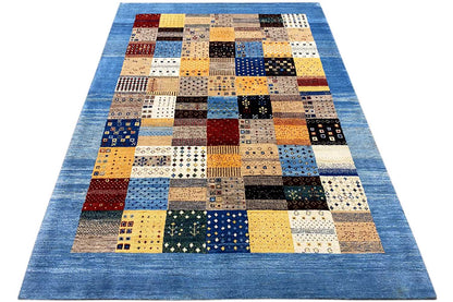 Geometric Gabbeh rectangular rug with patchwork layout in blue, yellow, black, and beige